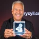 Howie Mandel holding a custom 3DCrystal.com gift, symbolizing the company's success through attention to detail.