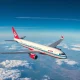 Airliner on final approach representing the end of longest US flight route cancellation