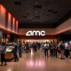 AMC's new strategy boosts AMC customer retention, showing happy moviegoers enjoying an enhanced theater experience.