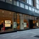 The closed storefront of a British retailer signals its exit from the U.S. market, reflecting broader retail challenges.