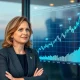 Cathie Wood, CEO of ARK Invest, strategically investing in AI stock, demonstrating her firm's focus on disruptive innovation.