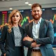 Taylor Swift and Travis Kelce demonstrating celebrity stock boost effect on financial markets