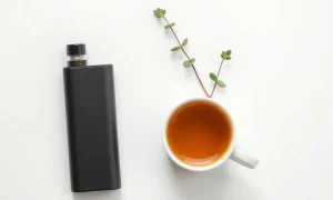 A person holding a sleek, modern chill vape device, conveying a sense of relaxation and ease during a daily break.