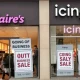 Signs announcing Claire's going-out-of-business sales, signaling the end of an era for the popular accessory retailer.