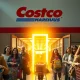 A person holding a Costco membership card, symbolizing the enhanced Costco member perks and new savings opportunities.