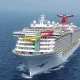 A Royal Caribbean cruise ship features a prominent water slide, highlighting the recent focus on **cruise ship safety** protocols after a recent incident.