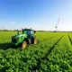 Advanced Deere & Company machinery working efficiently in a field, symbolizing the company's strong bull case for growth.