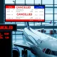 Delta Air Lines flights cancellation announcement at airport departure board