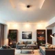 A modern living room bathed in the warm glow of efficient lighting, highlighting smart design choices for home illumination.