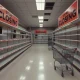 Electronics retailer store closures showing abandoned retail space with empty shelves and closing signs