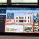 A digital dashboard displays real-time construction progress, connecting AMG Building with international clients overseeing luxury villa projects.