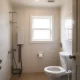 A modern San Diego home benefiting from new energy-efficient plumbing installations, showing water and energy savings.