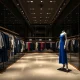 Luxury fashion brand filing Chapter 7 bankruptcy with empty boutique and closed signs