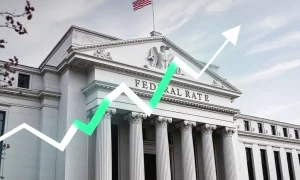 Federal Reserve official discussing upcoming interest-rate cuts during economic policy meeting