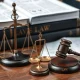 Legal defense against FTX fraud allegations with courtroom documents and justice scales