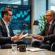 Financial adviser providing strategic wealth management consultation to investment executive