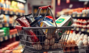 Rising food inflation shown through expensive chocolate, butter and eggs in shopping basket