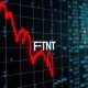 A red downward arrow on a stock chart graph, symbolizing the significant Fortinet stock drop and its impact on investors.