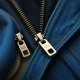Various garment zippers seamlessly integrated into different fabrics, illustrating their pivotal role in enhancing fit and style in apparel.