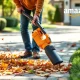 Powerful handheld leaf blower in action, clearing leaves efficiently, highlighting its ease of use and great value from Amazon.