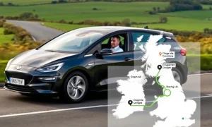 A Hertz electric vehicle confidently navigating a scenic route, powered by the Hertz EV Route Planner for a stress-free journey.
