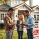 Home sellers reviewing market data and property valuation during changing real estate conditions