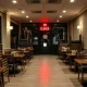 Hospitality job losses shown through closed restaurant with empty tables