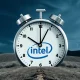 A stylized clock ticking down, with Intel's logo at the center, surrounded by competing Qualcomm and Arm logos, symbolizing the urgency for Intel's future.