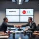 Keurig Dr Pepper JDE Peet's deal announcement with executives shaking hands over coffee products