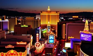 The iconic skyline of Las Vegas Strip casinos at night, bustling with activity, symbolizing the halt of a concerning economic trend.