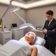 Professional LED light therapy treatment enhancing client skincare experience in modern spa setting