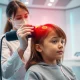 A professional uses advanced technology for a safe and effective lice treatment, symbolizing modern solutions for head lice.