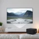 Compact portable projector displaying high-quality movie in modern living space