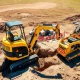 A yellow mini excavator efficiently digging on a job site, highlighting its precision and compact power for various construction tasks.