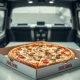 A Papa John's pizza box sits on a counter, symbolizing the company's renewed focus on Papa John's Pizza quality and efficient delivery services.