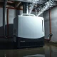 Pro-grade dehumidifier extracting moisture from flooded basement to prevent structural damage