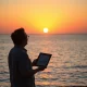 A person looking towards a sunset, symbolizing the journey to retire with 401k funds and achieve financial security in retirement.