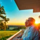 A couple enjoys a peaceful sunset, symbolizing successful retirement planning and financial freedom at 61.
