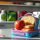 Rising school lunch costs affecting family budgets with peanut butter sandwich and back-to-school items