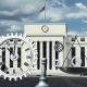 Federal Reserve building with a clock and gears, symbolizing the uncertain path of a potential September rate cut and economic compromise.