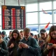 Travelers in an airport reacting to a Southwest Airlines policy change, highlighting the impact on customer experience.