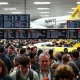 Travelers face significant delays and frustration due to widespread Spirit Airlines cancellations at a busy airport terminal.