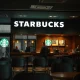 Starbucks struggles evident in empty store with concerned staff during business downturn