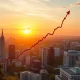 Graph showing a significant **stock market rally** after a key Federal Reserve announcement, illustrating investor optimism and a potential late-summer surge.