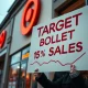 Target boycott protest outside retail store with declining sales charts