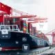 Temu shipping containers arriving at US port during tariff negotiations