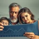 An image depicting Americans worried about the economic impact of rising trade tariffs, leading to inflation and unemployment.