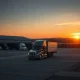 An empty truck depot at sunset symbolizes a significant trucking company closure, highlighting broader industry challenges.