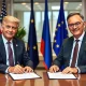 US-EU tariff deal signing ceremony with officials finalizing LNG and AI-chip agreements