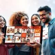 A diverse group of digital creators interacting with a seamless superapp interface on a device, symbolizing the empowerment offered by VuMe Live.